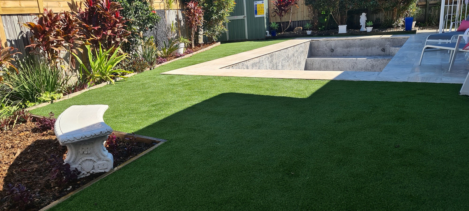 natural looking fake grass, layed around a pool